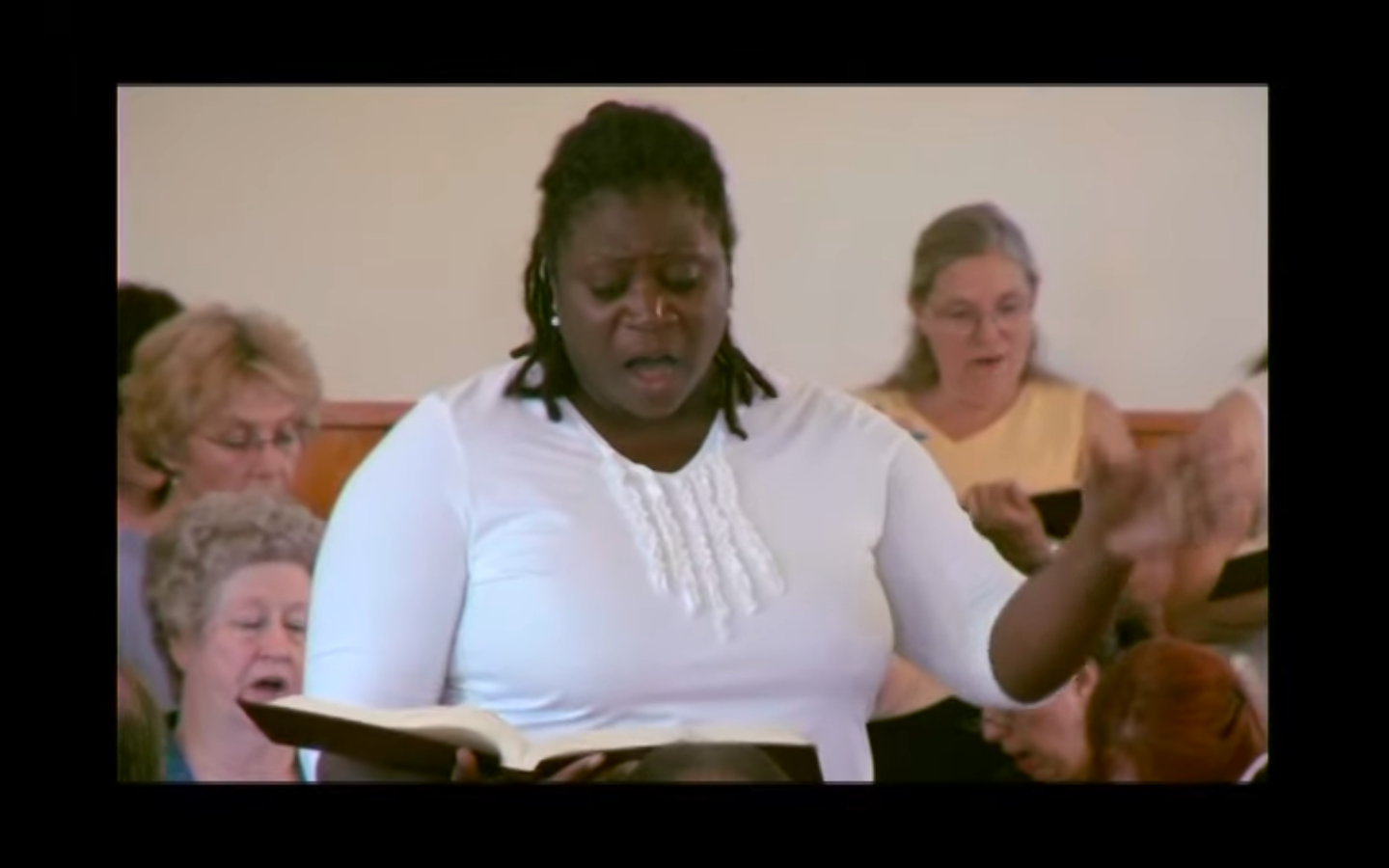 Woman leading a Sacred Harp song